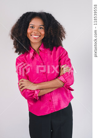 Young pretty African American woman standing and arms crossed over white background. 118539558