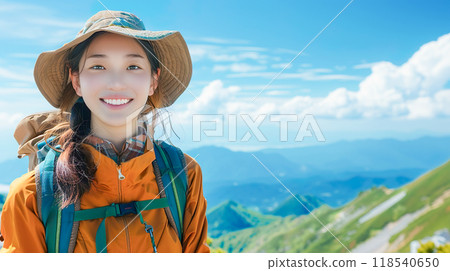 Smiling young woman climbing a mountain 118540650