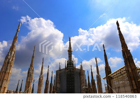 The main spire of the Duomo of Milan from the terrace 118540863