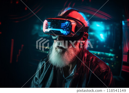 An elderly man with a distinguished gray beard immerses himself in a virtual reality experience, wearing VR glasses 118541149