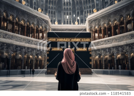 Muslim Woman in a Hijab Standing in Front of the Sacred Kaaba in Mecca.Generated image 118541583