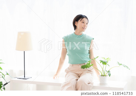 A woman relaxing in the room 118541733