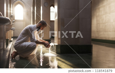 Preparing for Prayer: A Young Muslim Performing Ablution with Devotio.Generated image 118541879