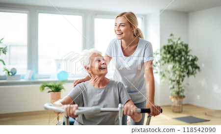 A medical professional engages in therapeutic exercises with an elderly woman in a wheelchair, utilizing a ball and various aids, exemplifying compassionate care and rehabilitation support in the 118542090