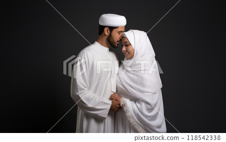 Portrait of a Muslim couple in white Ihram garments at a sacred site, reflecting their devotion and unity during pilgrimage.Generated image 118542338