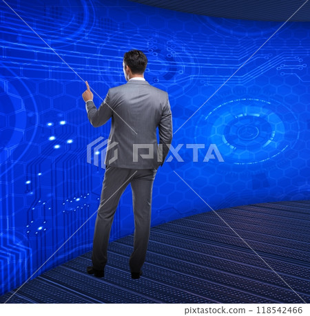 Businessman pressing virtual buttons in futuristic concept Businessman pressing virtual buttons in futuristic concept 118542466