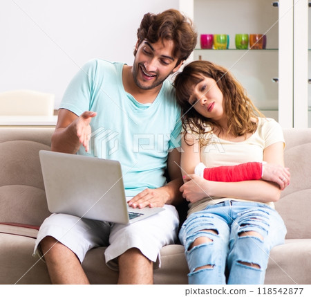 Young family helping each other after injury Young family helping each other after injury 118542877