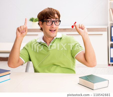 Student throwing dart in education concept Student throwing dart in education concept 118542881