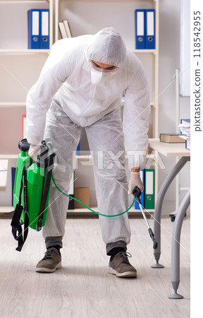 Professional contractor doing pest control at office Professional contractor doing pest control at office 118542955
