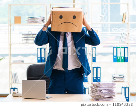 Unhappy man with box instead of his head 118543358