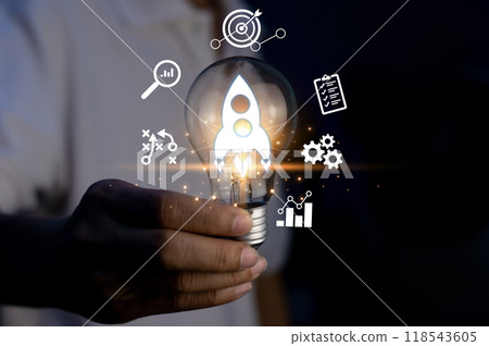 Rocket launch idea inside lightbulb. strategically planning and initiating a corporate startup. aim to achieve objectives through value development, fostering leadership 118543605