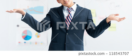 Young foreign businessman shrugging his shoulders Young foreign businessman shrugging his shoulders 118543707