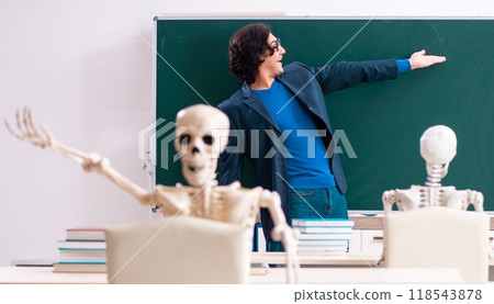 Male teacher and skeleton student in the classroom Male teacher and skeleton student in the classroom 118543878
