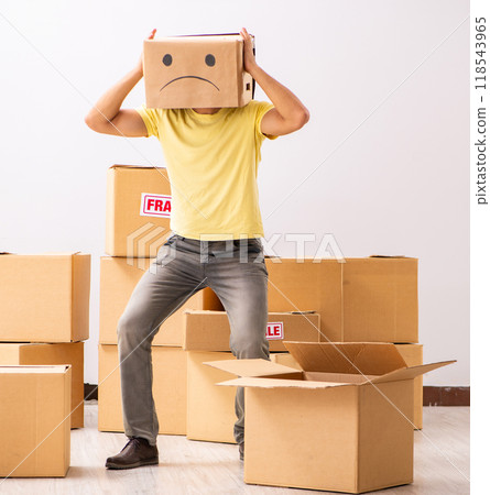 Unhappy man with box instead of his head 118543965