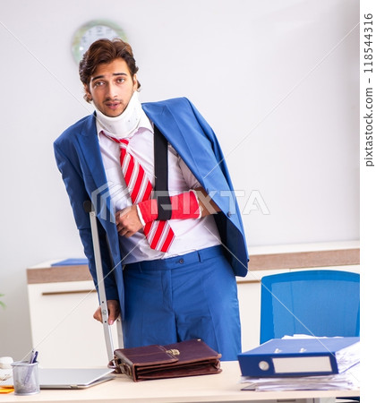 Injured employee working in the office 118544316