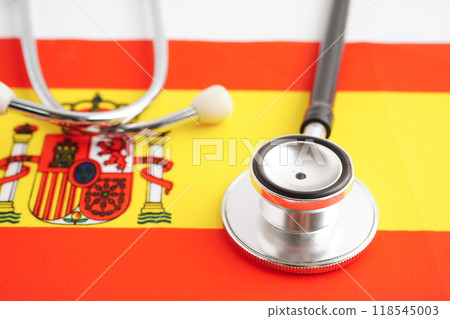 Spain flag with black stethoscope, Business and finance concept. Spain flag with black stethoscope, Business and finance concept. 118545003