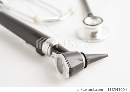 Otoscope isolated on white background for otolaryngologist or ENT physician doctor examining senior patient ear, hearing loss problem. Otoscope isolated on white background for otolaryngologist or ENT physician doctor examining senior patient ear, hearing loss problem. 118545004