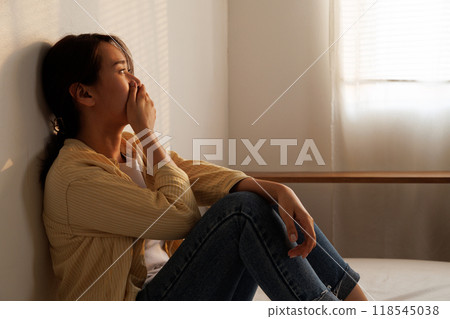 Depressed young asian woman with mental health problem in mind need crucial treatment from overthinking fatigue girl, disruptive thought, dissocial, anxiety and mental health disorders. 118545038