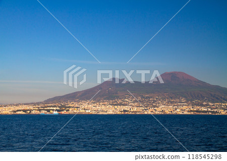 Southern Europe, Italy, Campania, Naples, Province of Naples, Mount Vesuvius and the cityscape at its base as seen from a boat in the Bay of Naples Southern Europe, Italy, Campania, Naples, Province of Naples, Mount Vesuvius and the cityscape at its base as seen from a boat in the Bay of Naples 118545298