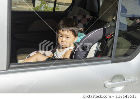 Baby sitting in a child seat (boy, 1 year old, Japanese) Baby sitting in a child seat (boy, 1 year old, Japanese) 118545535