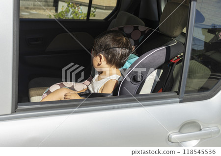 Baby sitting in a child seat (boy, 1 year old, Japanese) Baby sitting in a child seat (boy, 1 year old, Japanese) 118545536