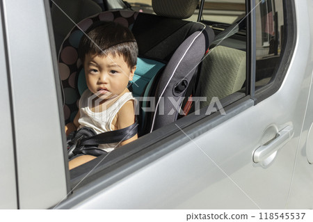 Baby sitting in a child seat (boy, 1 year old, Japanese) Baby sitting in a child seat (boy, 1 year old, Japanese) 118545537