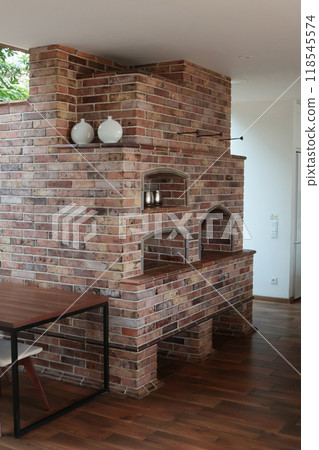 Modern brick oven in large house. Interior in living room. Kitchen and cooking. Lifestyle and furniture.  118545574