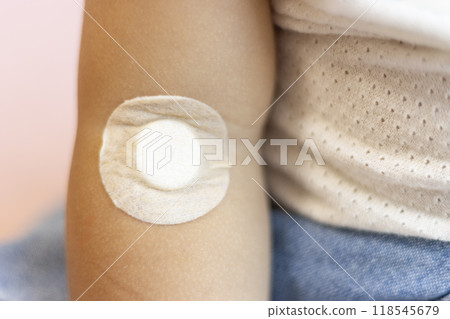Baby's arm with bandage on after blood draw Baby's arm with bandage on after blood draw 118545679