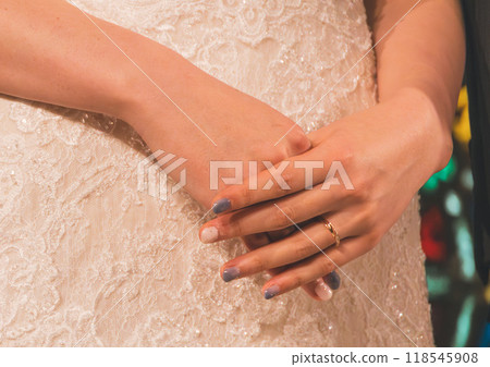 Bride's hand with wedding ring Bride's hand with wedding ring 118545908