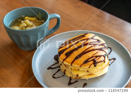 Hot cake with chocolate sauce 118547299