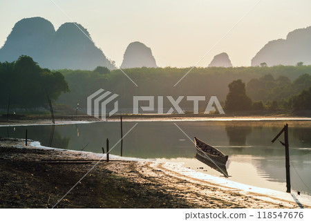 Wooden boat on Nong Thale lake  with reflection at sunrise, Krabi 118547676