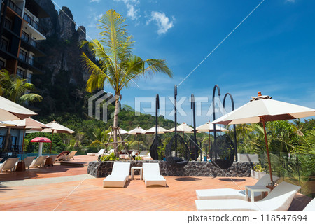 sunbath bedchair at swimming pools of hotel in Ao Nang, Krabi 118547694