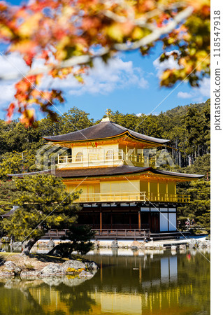 Golden pavilion of the Kinkakuji temple surrounded with Japanese garden and pond in Autumn season. Kyoto, Japan. Golden pavilion of the Kinkakuji temple surrounded with Japanese garden and pond in Autumn season. Kyoto, Japan. 118547918