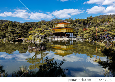 Golden pavilion of the Kinkakuji temple surrounded with Japanese garden and pond in Autumn season. Kyoto, Japan. 118547920