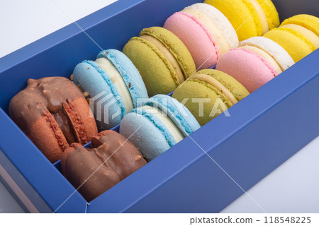 Exclusive macaroons in blue box isolated on the white Exclusive macaroons in blue box isolated on the white 118548225