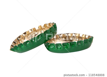 Metallic green two beer caps isolated on the white 118548808
