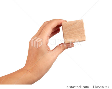 Wooden square cube in hand isolated on the white 118548947