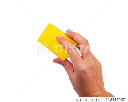 Sponge for washing dishes in hand isolated on the white 118548967