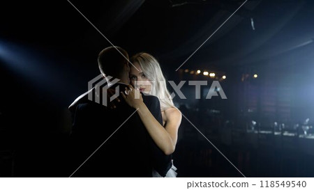 Elegant couple dancing romantically in soft lighting 118549540