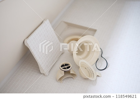 Cleaning the bathtub drain Cleaning the bathtub drain 118549621