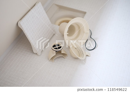 Cleaning the bathtub drain Cleaning the bathtub drain 118549622