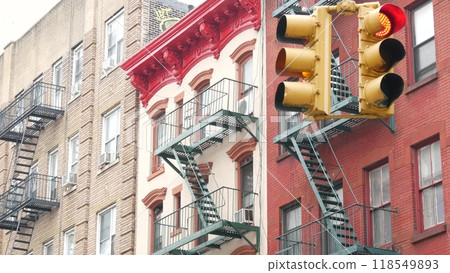 New York City street crossroad, yellow traffic light, transport road intersection, United States. 118549893