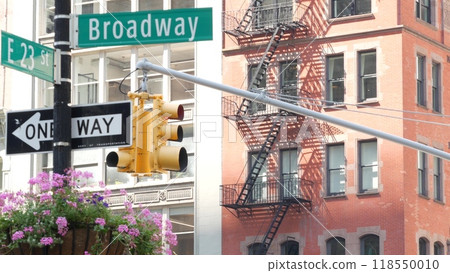 Broadway street road sign, Manhattan midtown architecture, New York City. Traffic signage of 23 st. 118550010