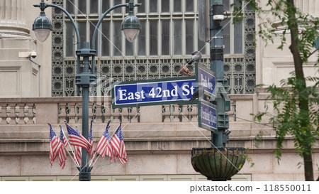 New York City Grand Central Terminal, 42 street sign, Park Avenue, Pershing Square. American flag. 118550011
