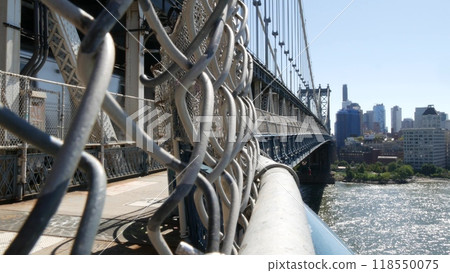 New York City Manhattan Bridge to Dumbo, Brooklyn. Waterfront skyline cityscape from pedestrian path New York City Manhattan Bridge to Dumbo, Brooklyn. Waterfront skyline cityscape from pedestrian path 118550075