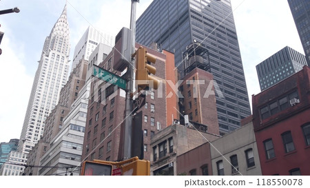 New York City crossroad, street intersection road sign on post. Chrysler building, Midtown corner. 118550078