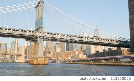 New York City Manhattan Bridge to Brooklyn. Waterfront downtown skyline cityscape, river Pier 35. New York City Manhattan Bridge to Brooklyn. Waterfront downtown skyline cityscape, river Pier 35. 118550090