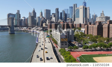 Brooklyn Bridge from Manhattan Bridge. New York City downtown skyline, financial district cityscape. Brooklyn Bridge from Manhattan Bridge. New York City downtown skyline, financial district cityscape. 118550104
