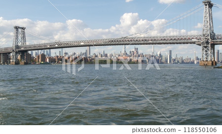 New York City skyline from ferry boat. Manhattan midtown, East river, Williamsburg Bridge, USA. 118550106