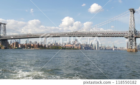 New York City skyline from ferry boat. Manhattan midtown, East river, Williamsburg Bridge, USA. 118550182